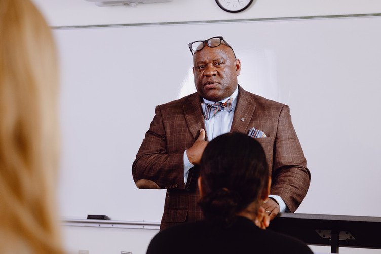 An international business MBA degree holder conducting a presentation.