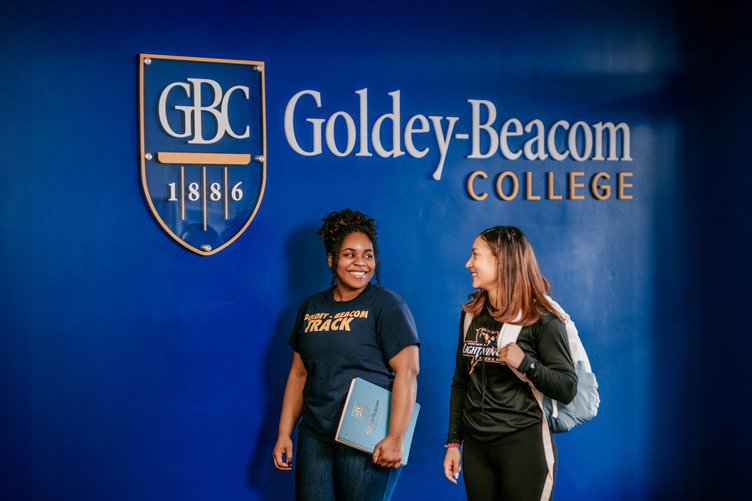 A pair of students, appreciating business degree relevance even in the growing reach of AI tools.