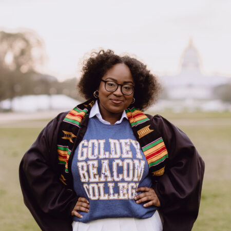 A portrait of Cierra in commencement regalia and a Goldey-Beacom College sweater