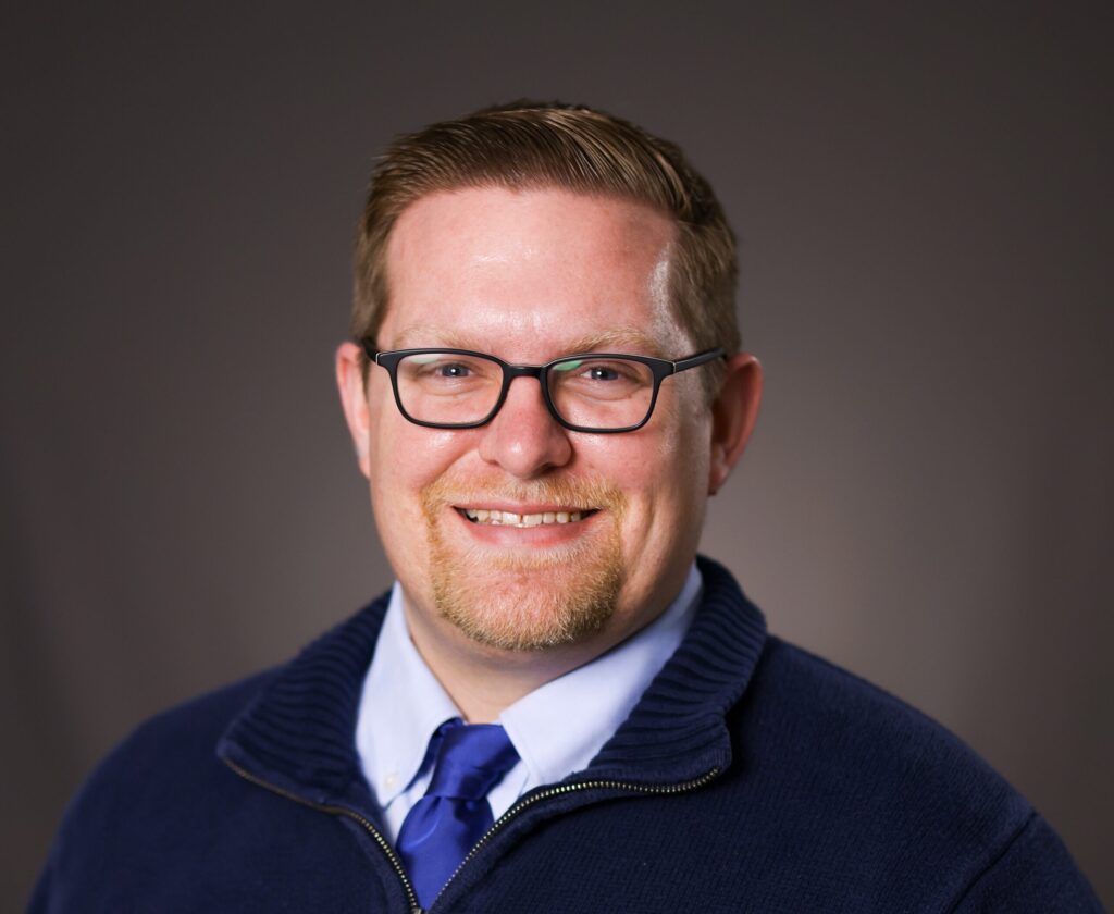 Headshot of Registrar Ryan Quann