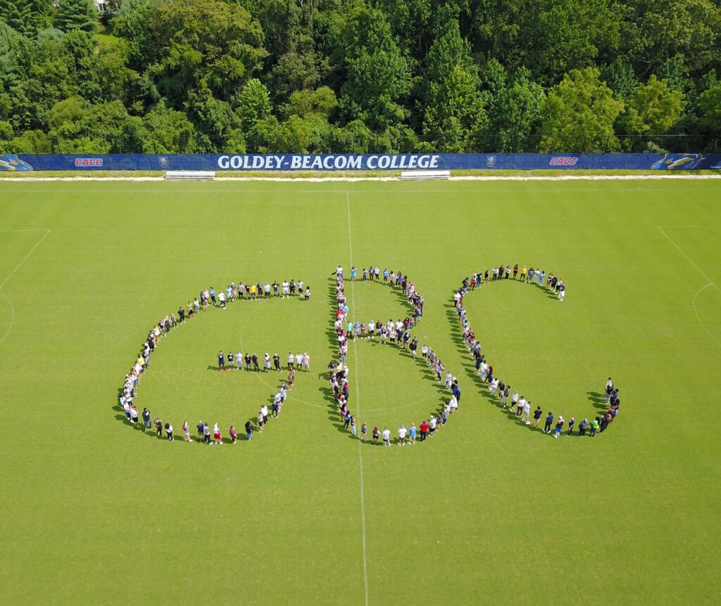 A drone shot showing GBC students form a "GBC"