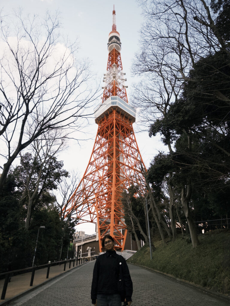 GBC student, Kiran Matro, in front of Tokyo Tower.