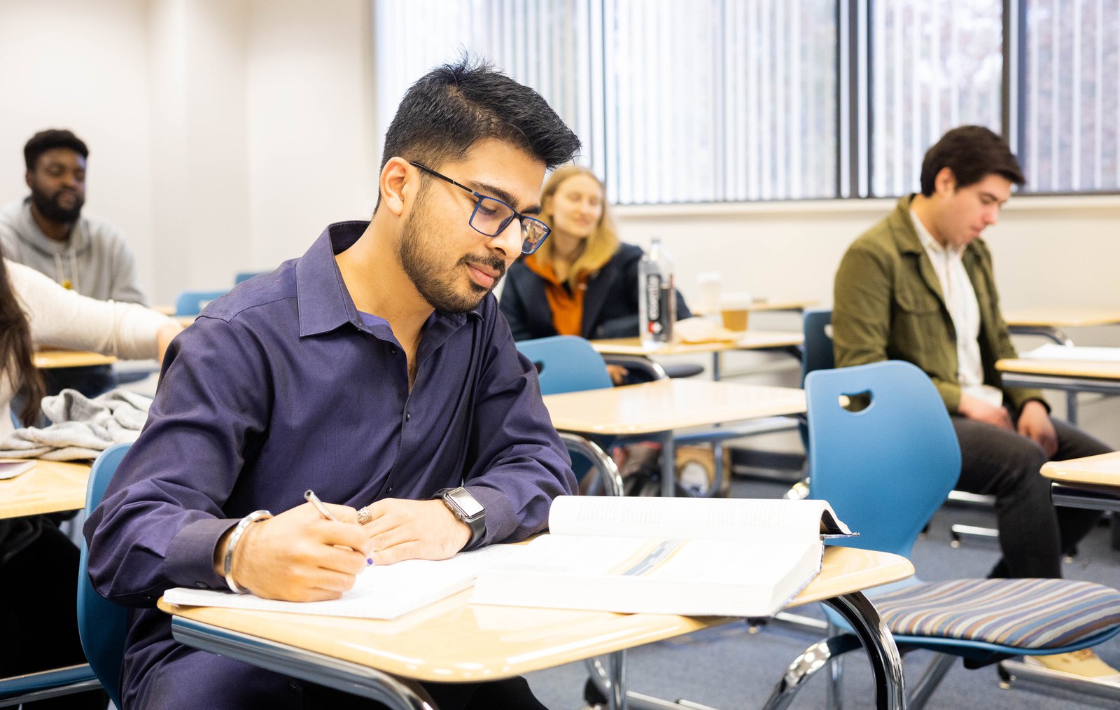 MBA students in a classroom studying who believe that an MBA is still worth it in 2026