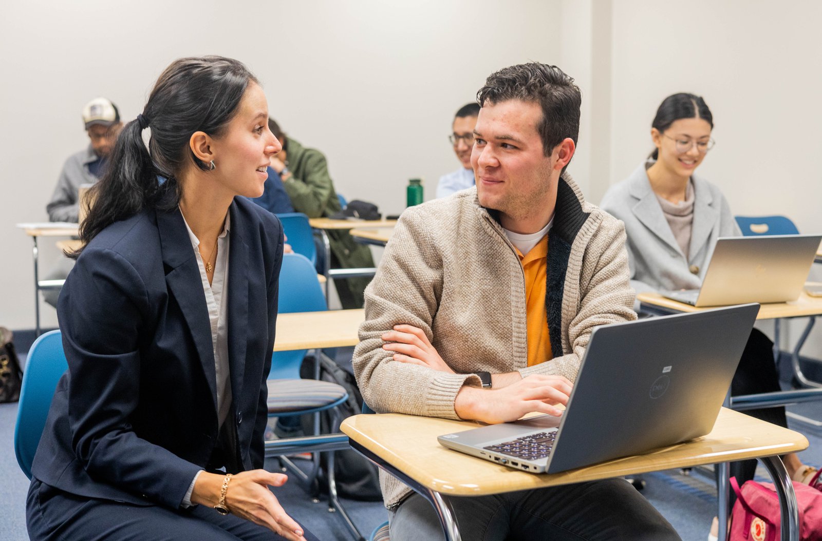 grad student and financial aid advisor figuring out how to pay for graduate school