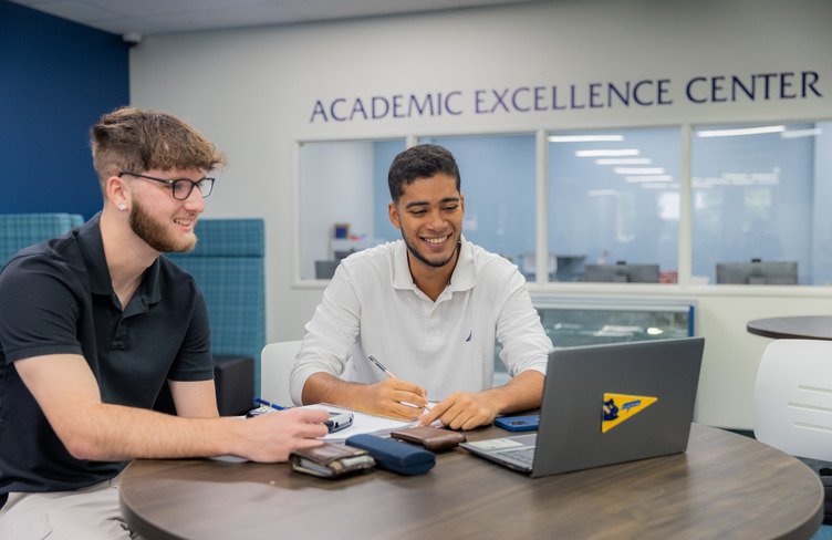 Students pursuing a counseling psychology degree, studying in the library